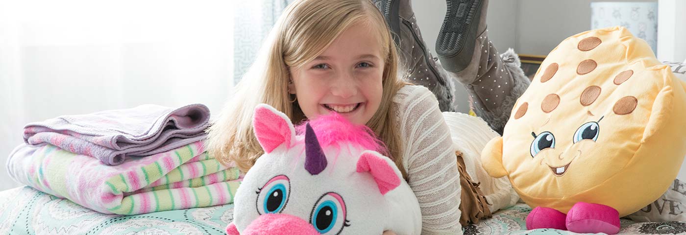 Happy child with her stuffed toys